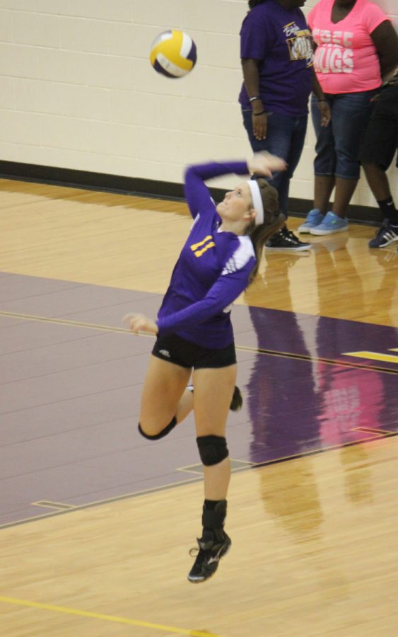 Senior Taylor Rutledge gets off the floor to sned the ball over the net for a point in the Lady Bisons preseason game against Oakwood. The Ladies won in three sets. 