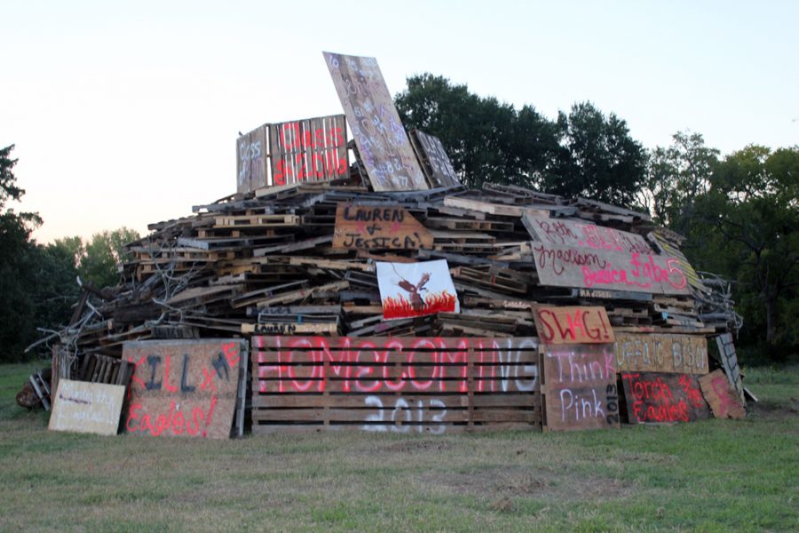 Students+and+faculty+worked+together+to+build+the+first+bonfire+at+BHS+for+the+past+two+decades.+