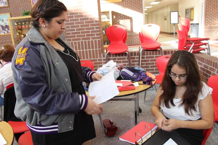 Seniors Erica Rios and Jade Morales work on their LD cases before heading into the competition room. The speech team brought home the second-place sweepstakes trophy from the invitational at Groesbeck.