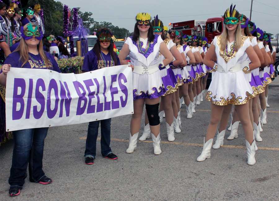 The+Bison+Belles+show+off+their+Mardi+Gras+masks+during+the+parade.