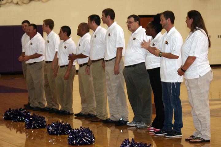 The coaching staff stands to be introduced during Meet the Bison. 