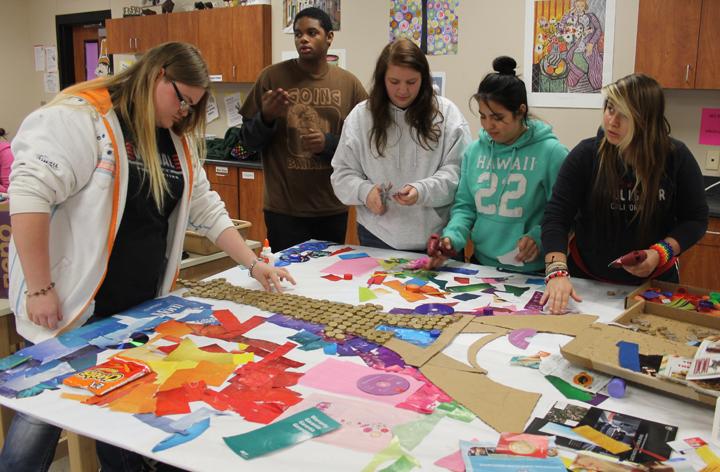 Art students work on creating their entry for the annual Nucor Junk Art contest. The local judging will be held on November 6.