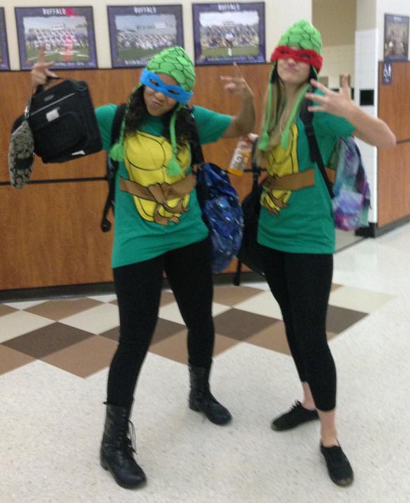 Seniors Erykah Anderson and Kendall Lee sport Teenage Mutant Ninja Turtle outfits for Twin Day.