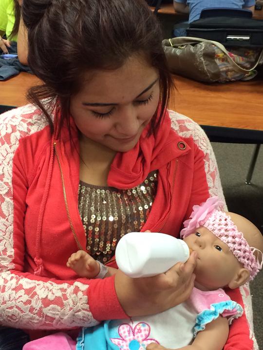Feeding babies was just one of the tasks students with infant simulators had to tend to on their turn with the babies. 