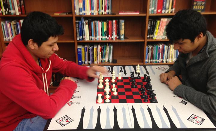 Seniors Rudy and Randy Salazar play chess in the library. The twins swapped spots for their morning classes last week.