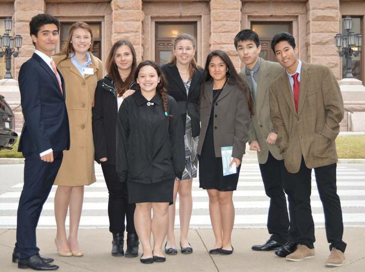Students visiting the capitol with the exchange student program bundled up for the cold weather that covered the state.