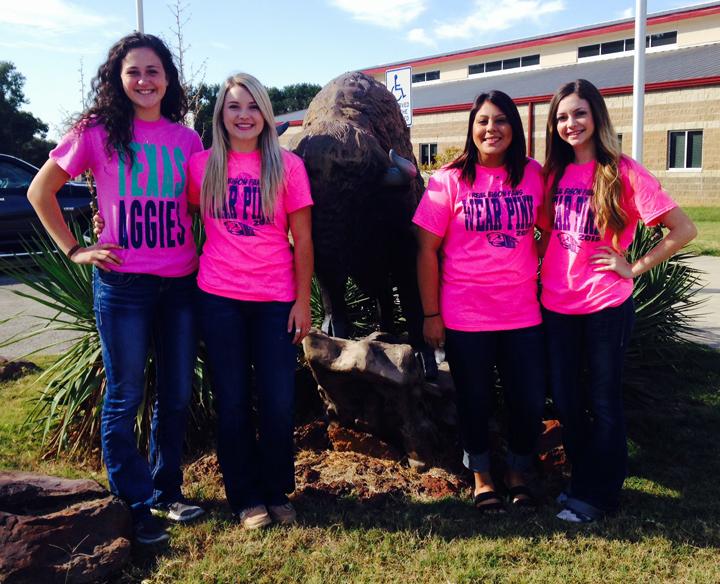 Homecoming queen candidates Allison Grissett, Jacie Jones, Brittnie Garcia and Ally Gaskins pose in front of the high school.