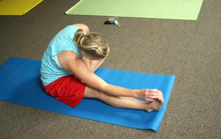 Teacher Jill Henson stretches during yoga class. The teachers get together every Monday and Wednesday for the class, which is taught by teacher Cindy Eppes.
