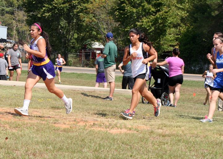 Sophomore Nadia Garcia leads a pack of runners during a cross country meet.