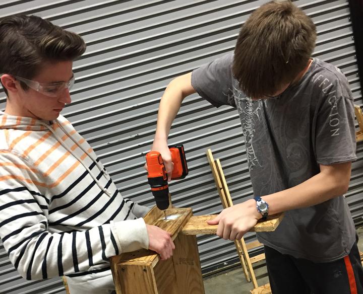 Tech students Dylan Magouirk and Jacob Patterson work on set pieces for the OAP, which is titled Rivers of Ink and is set in Baghdad in the 13th century.