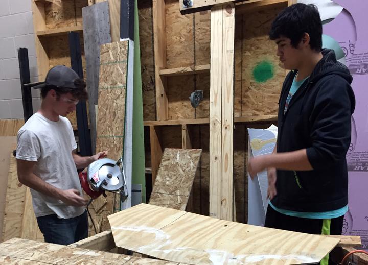 Tech members David McAlpine and Israel Rendon break out the power tools while working on the OAP set.