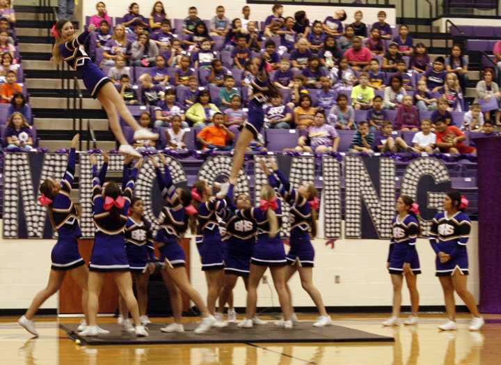 The cheerleaders perform at a football pep rally earlier in the year. The group will be competing this week in UIL competition, which is a new addition for the UIL.