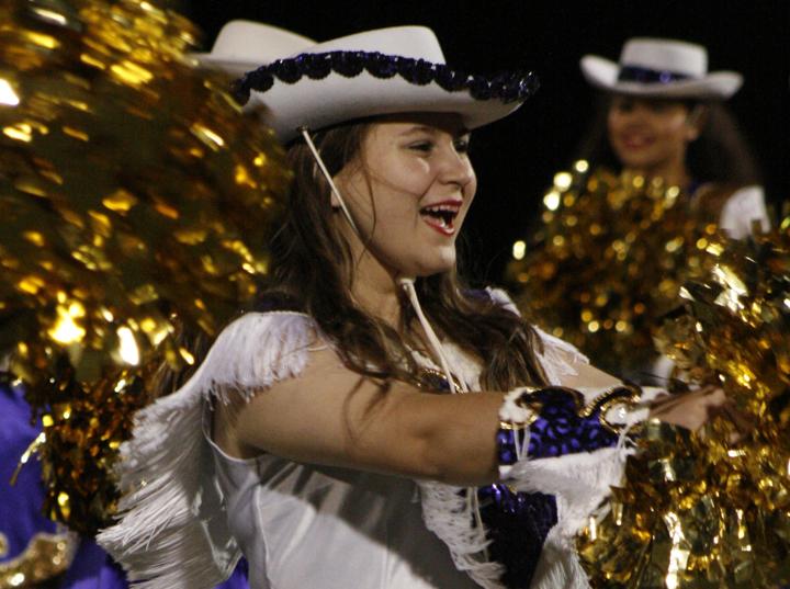 Sophomore Chelsea Harter dances with the Belles at halftime.