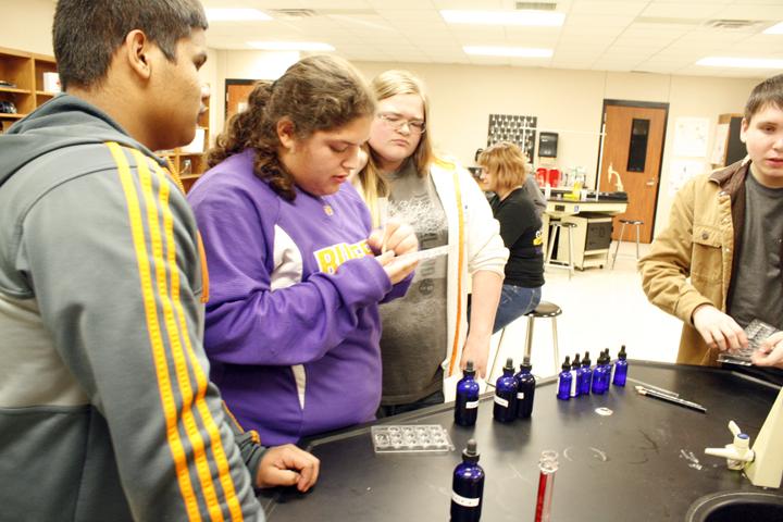 Students works on typing blood during forensics class.