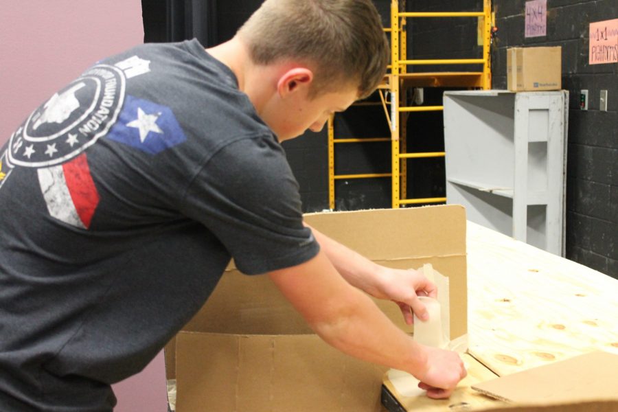 Theatre tech students work on musical set