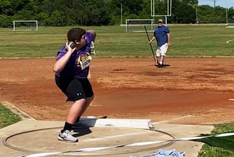 Senior Asa Henson competes in shot put at the regional track meet. 