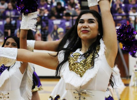 Belle Captain April Martinez leads her team while performing at a pep rally. When April is not busy with school activities, she works for Kona Ice.