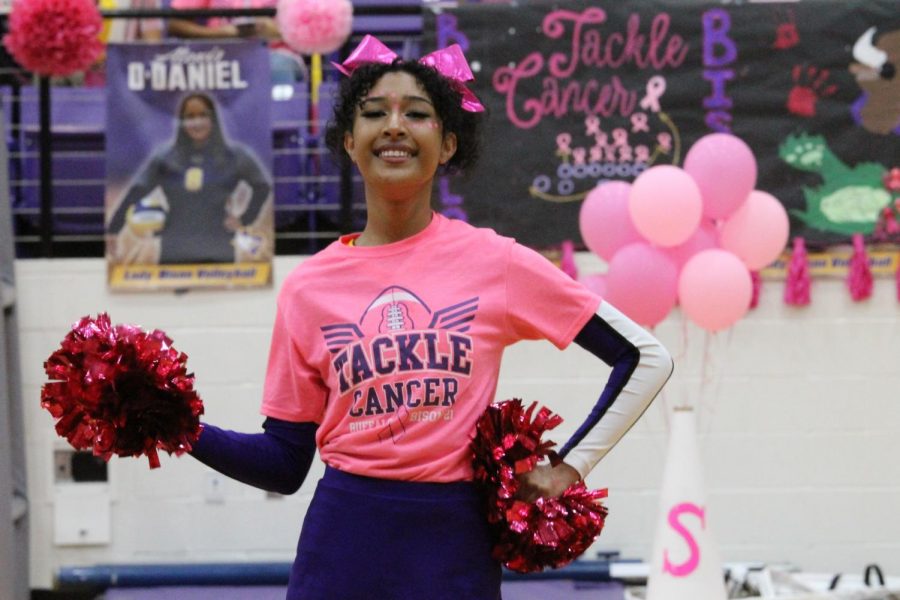 Junior+Alani+Jones+shows+off+her+pink+while+dancing+at+the+Pink+Out+pep+rally.+The+cheer+t-shirts+earned+money+to+donate+to+breast+cancer+research.