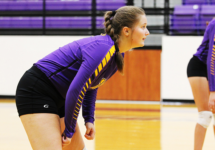 Sophomore Bradyn Lack gets ready to receive the serve during a home volleyball game. Lack moved up to JV Purple before the Centerville game. 