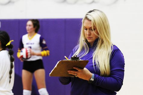 Coach Judith Harris works on team strategy during a Lady Bison volleyball game. This is Harriss first year as head varsity coach and girls coordinator. 