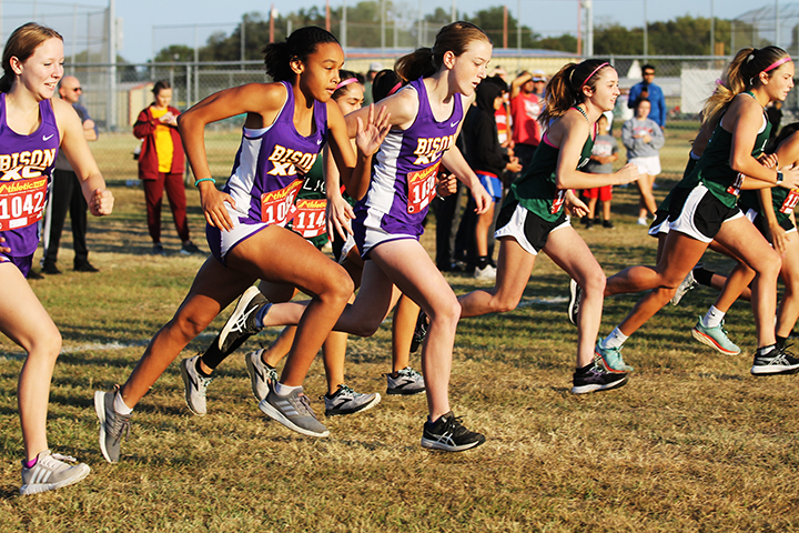 Varsity girls take off at the beginning of their district race. Freshman Victoria Brooks will compete at regionals. 