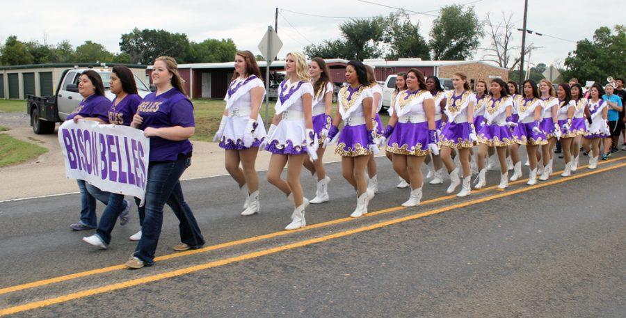 The Bison Belles marched in the parade without their hats since even a few drops of rain would have destroyed them. Heavy, continuous rains the day before the Stampede had parade-goers worried about a cancellation, but the rain stopped overnight.