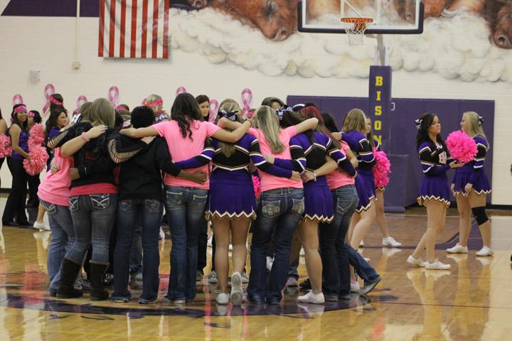 The Lady Bison huddle up on the court for a good-luck wish during the Pink Out pep rally the Friday before their tie-breaker game against Rice. The team won the game to clinch third place, and will start their play-off run Tuesday night at Madisonville High School with a game against Anderson-Shiro.