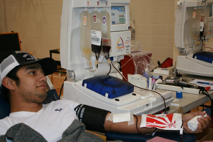 Junior+Jose+Guzman+sits+back+and+relaxes+while+giving+blood+at+the+NHS+blood+drive+last+week.+