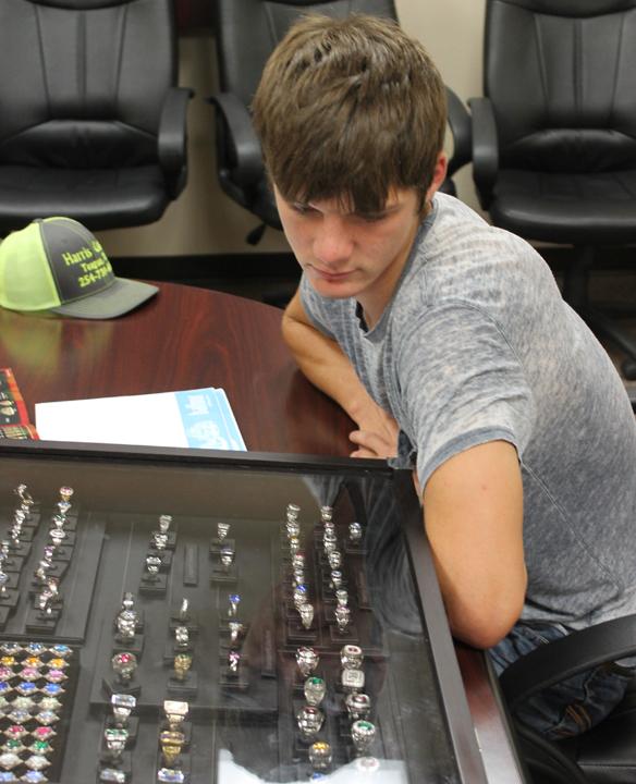 Junior Lane Solley looks over the ring choices before placing his order with Balfour. 