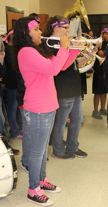Bison Brigade member Diana Avila plays at the pep rally before the Lexington game.