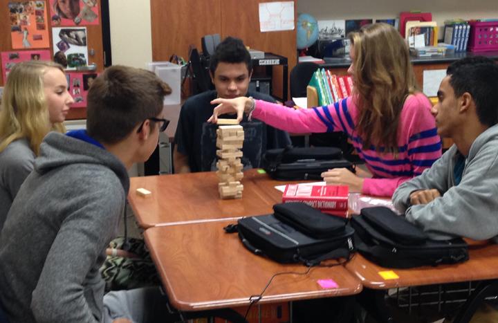 Junior Kat Galle stacks a Jenga! block during a review in teacher Melonie Menefees Engliah 3 class. 