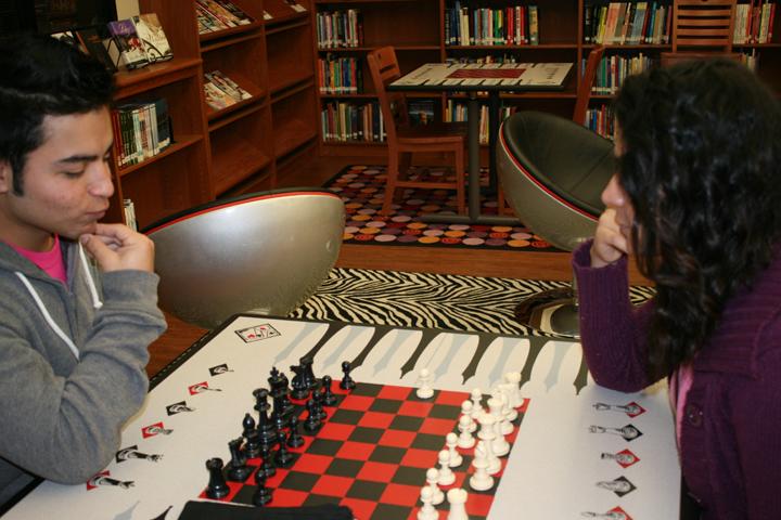 Senior+Sergio+Vazquez+and+junior+Miryam+Zapata+spend+their+activity+period+engrossed+in+a+chess+game.+