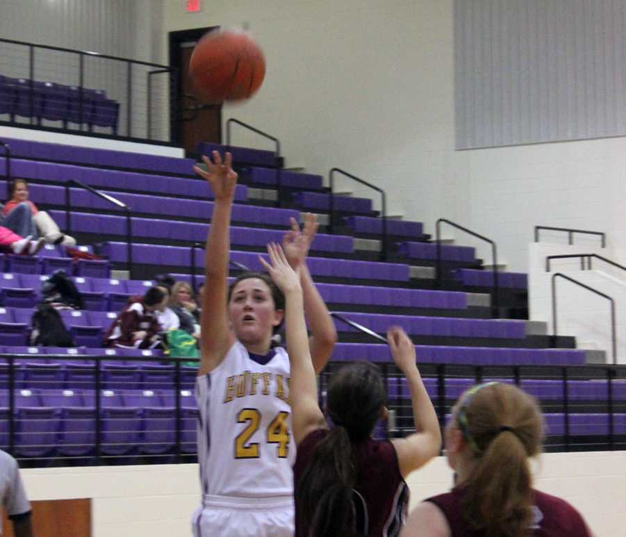 Junior Allison Grissett launches the ball into the air for two points. 
