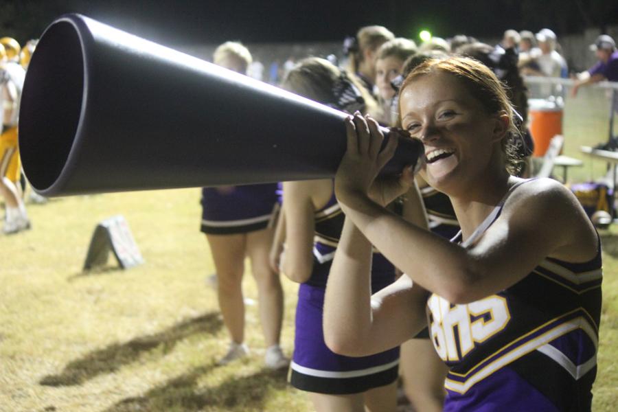 Junior Taylor Shelton cheers at a football game earlier this year. Shelton is also involved in sports and several other organizations.