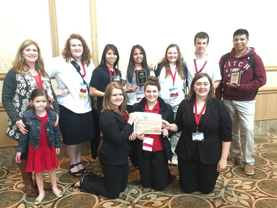 The FCCLA competitors pose with their sponsor, Wendy Neyland, and the awards they received at regional competition in Galveston. Three teams will advance to state in April.