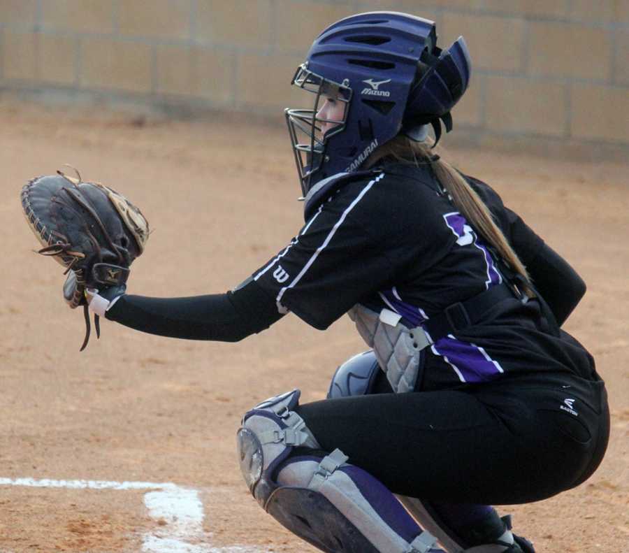 Sophomore Hannah Eakin works her catchers spot behind the plate. 