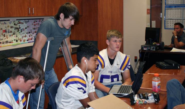 Freshman Trevor King hangs out with some of his classmates during activity period.