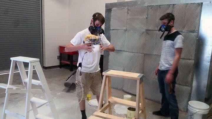 Ag students try out the new painting booth to paint ladders for the Bison Belles.