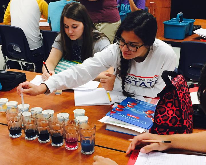 FCS students Kendall Morales and Chelsea Harter test pH levels in teacher Wendy Neylands class.