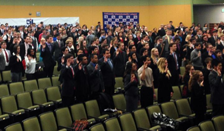 Competitors at state congress take the oath of office before starting their debates.
