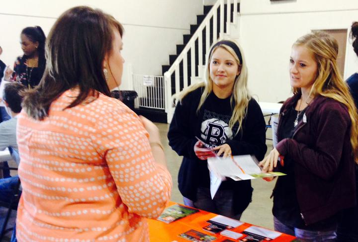 Seniors Jacie Jones and Taylor Shelton visit with the Sam Houston rep at a fall college fair in Jewett. Jones plans to attend SHSU in the fall.