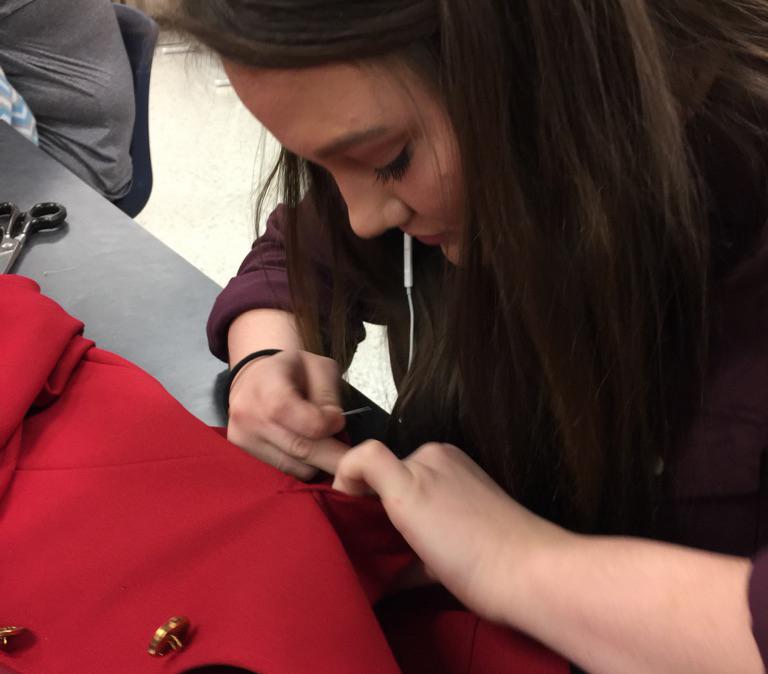 Senior Brianna Johnston works on a clothing project during FCS class.