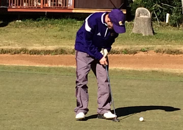 Justin Foley focuses on his shot at an early-season golf tournament.