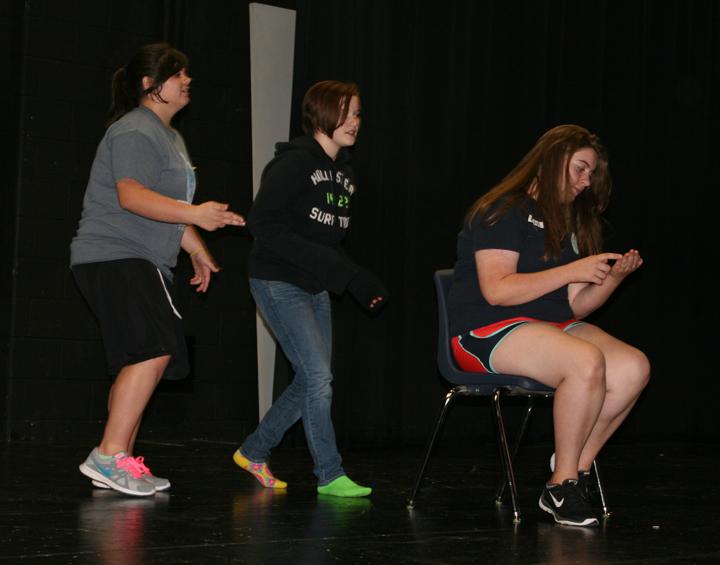 Sophomore Kaiden Loep and freshman Ally Smith participate with Leon students in a motion clinic for Theatre. Loep says that Theatre is her favorite class.