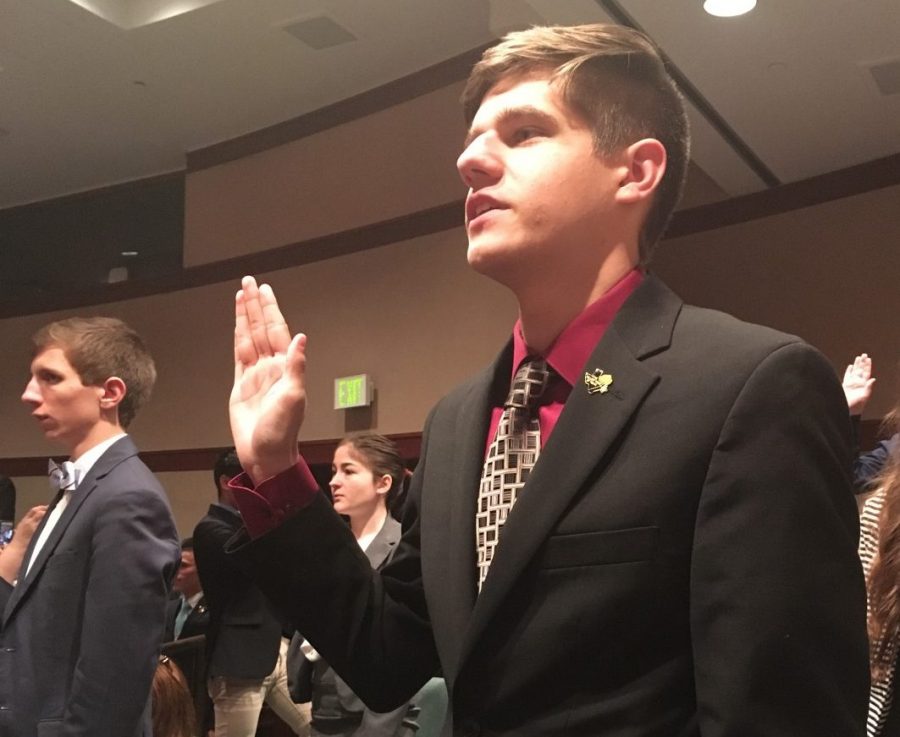 Senior Evan Grisham takes the Oath of Office before competing in state Congress finals in the Texas Capitol last week. Evan was one of 18 3A debaters who made it to finals.