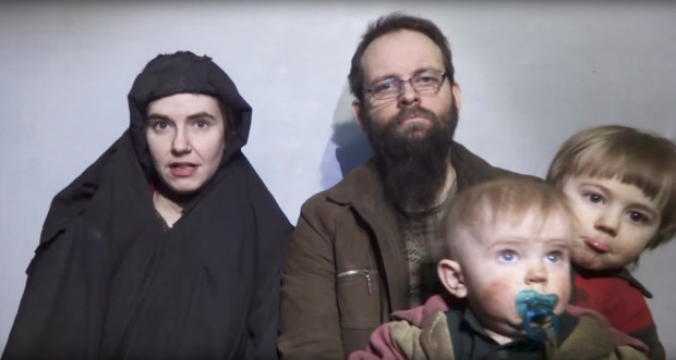 In this image from video released by Taliban Media in December 2016, Caitlan Coleman talks in the video while her Canadian husband Joshua Boyle holds their two children. U.S. officials said Pakistan secured the release of Coleman of Stewartstown, Pa., and her husband, who were abducted five years ago while traveling in Afghanistan and then were held by the Haqqani network. Coleman was pregnant when she was captured. The couple had three children while in captivity, and all have been freed, U.S. officials said.  (Taliban Media via AP)