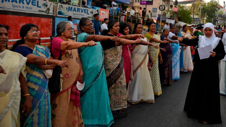 Women take pledge to fight gender discrimination as they form part of a 620 kilometers (388 miles) long womens wall in Thiruvanathapuram, Kerala, India,Tuesday, Jan.1, 2019. The wall was organized in the backdrop of conservative protestors blocking the entry of women of menstruating age at the Sabarimala temple, one of the worlds largest Hindu pilgrimage sites defying a recent ruling from India???s top court to let them enter. (AP Photo/R S Iyer)