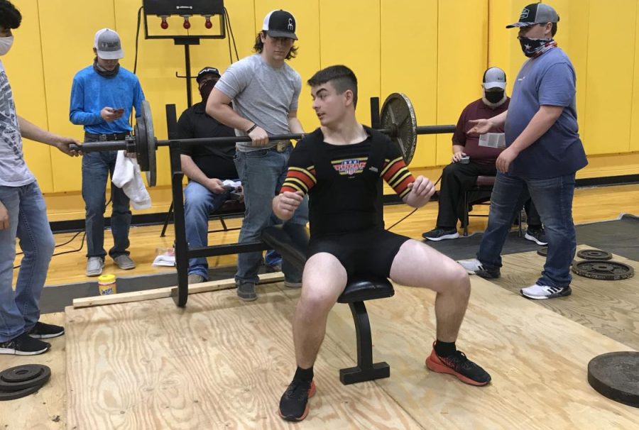 Sophomore Xander Cheek gets ready to lift at a recent meet in Fairfield. The boys lost two meets due to weather. 