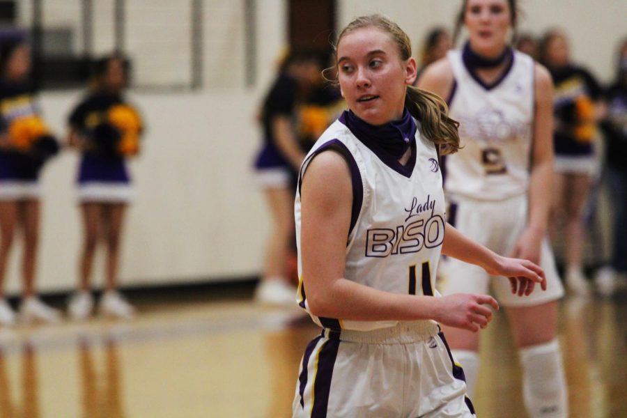 Freshman Elizabeth Daniel makes her way down the court during a basketball game. Daniel is on multiple varsity teams this year.