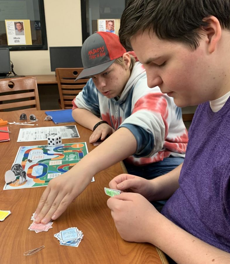 Sophomore Tiler Jameson and freshman Johnny Clements play a round of Call of the Wild after finishing their board game. The  students finished the novel this week.